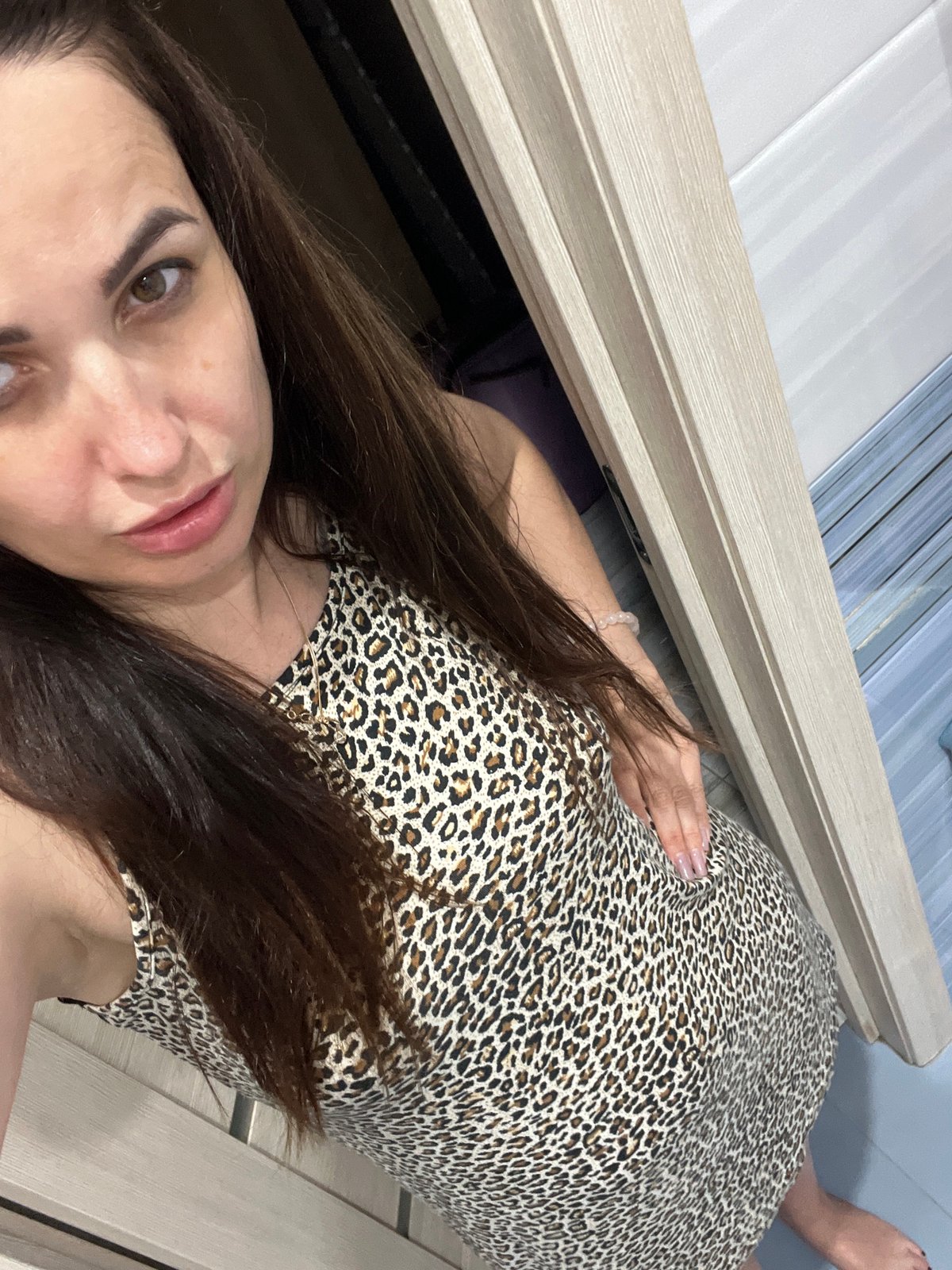 Bathroom photoshoot session with leopard-print outfit and multiple poses