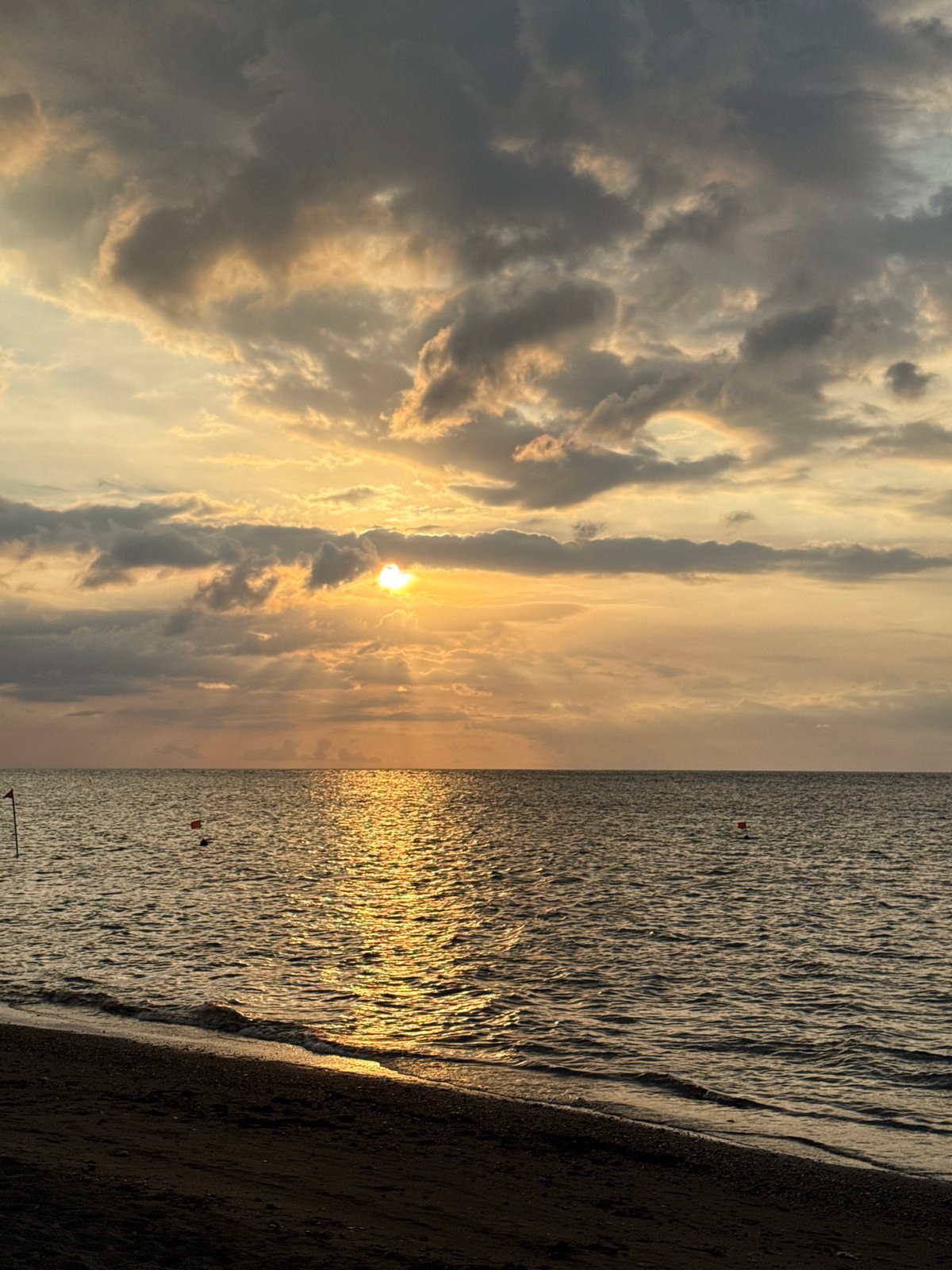 Sunset observed at Buleleng beach with golden water reflections