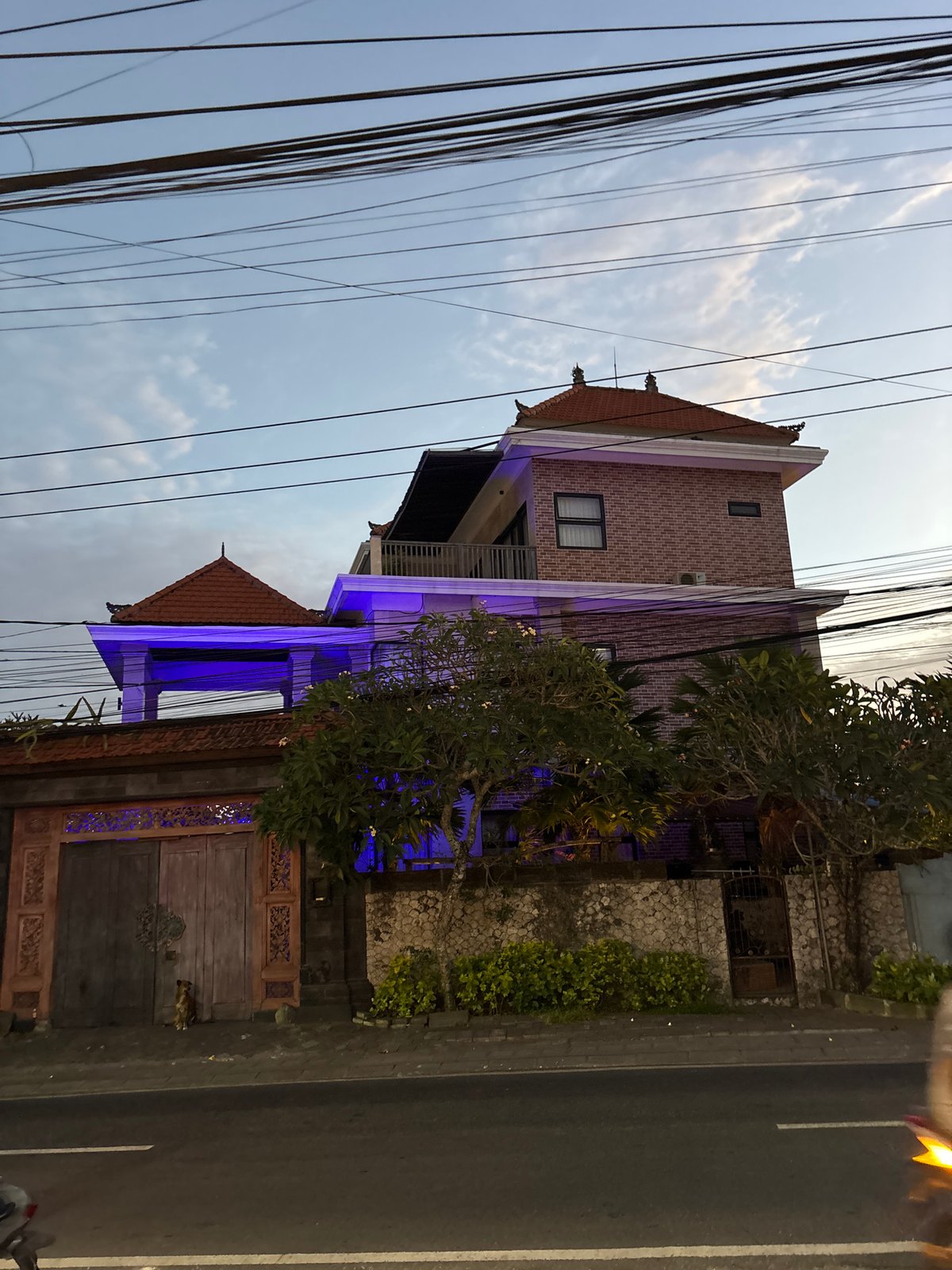 Blue-lit brick building observed in Kuta Selatan, Indonesia