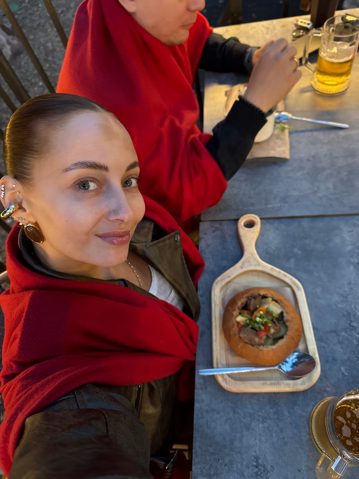 Couple enjoys evening meal at outdoor restaurant in Izhevsk