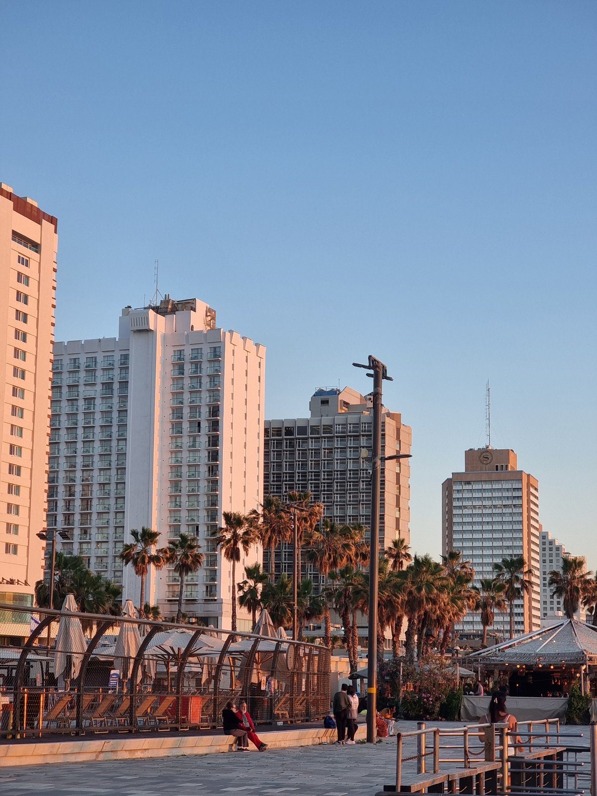 Sunset captured along Tel Aviv waterfront promenade and marina