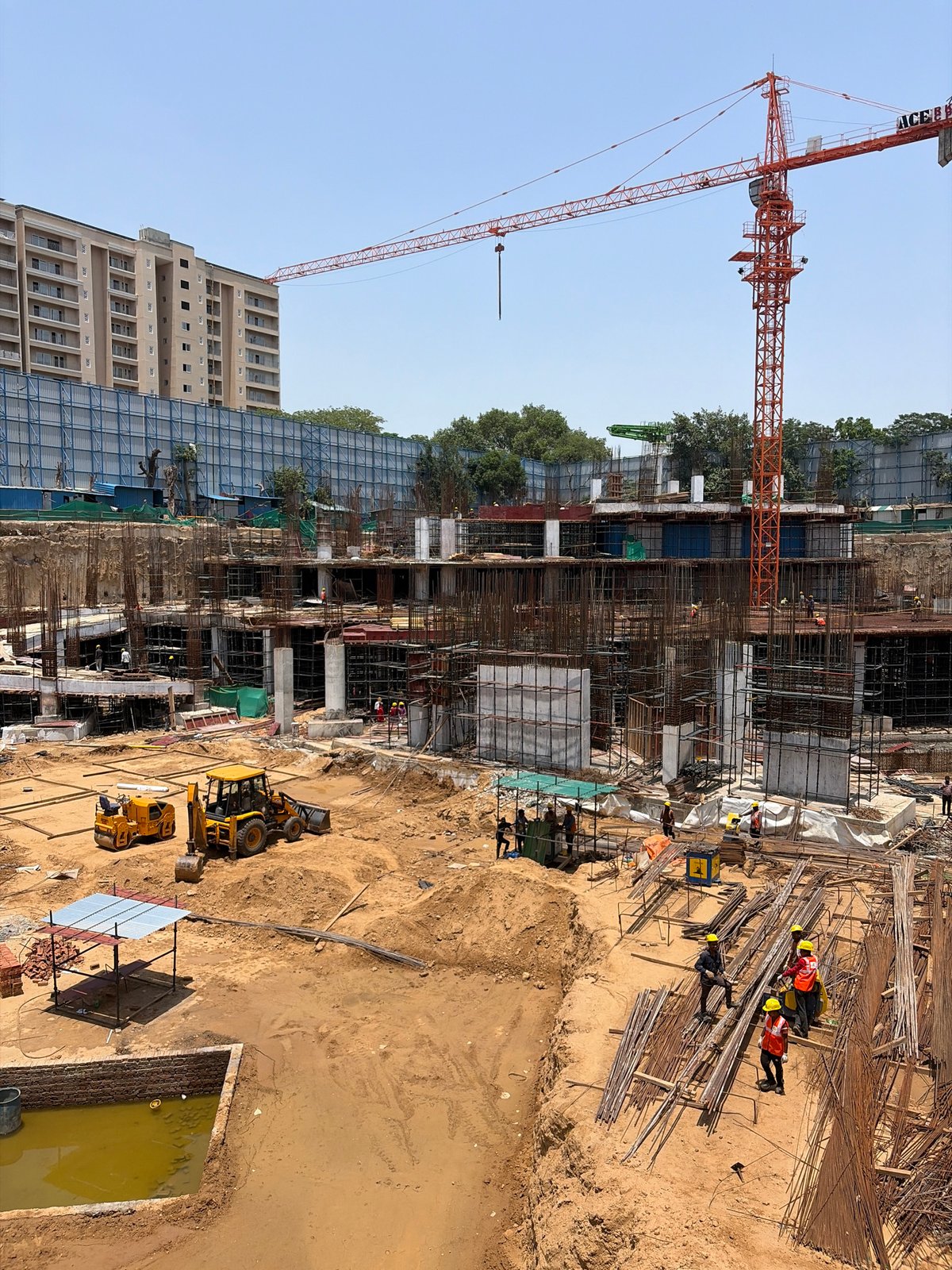 Active construction site in New Delhi, foundation to upper floors