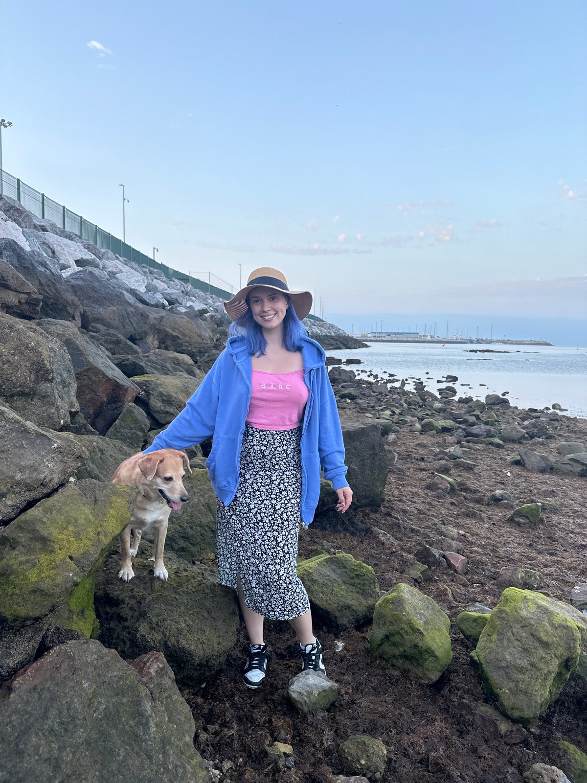 Evening beach exploration with dog documented in Gijón, Spain