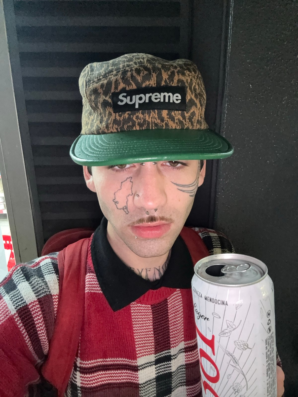 Portrait captured in Buenos Aires shows person in Supreme cap