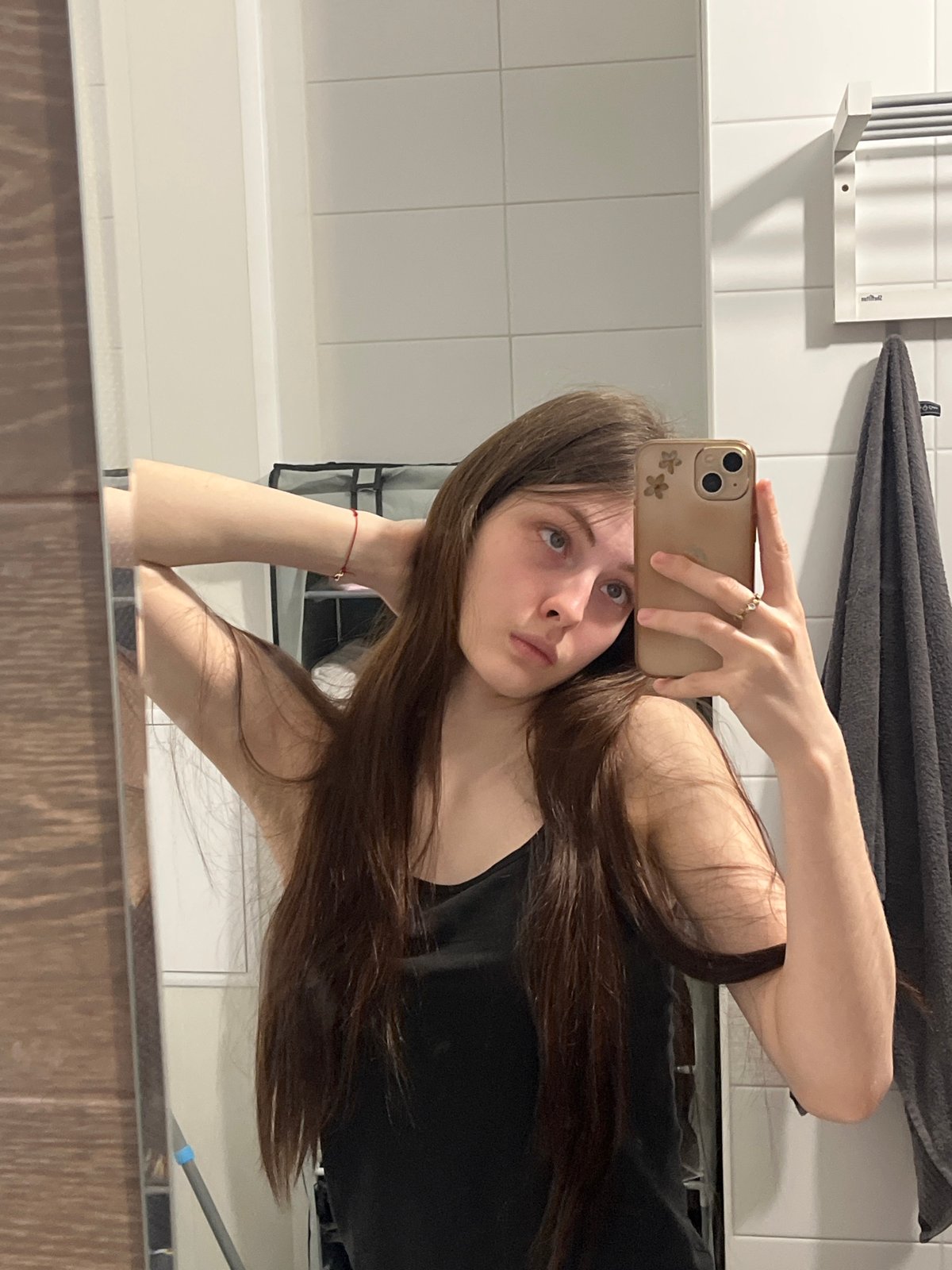 Woman documents quiet evening at home with cat selfies