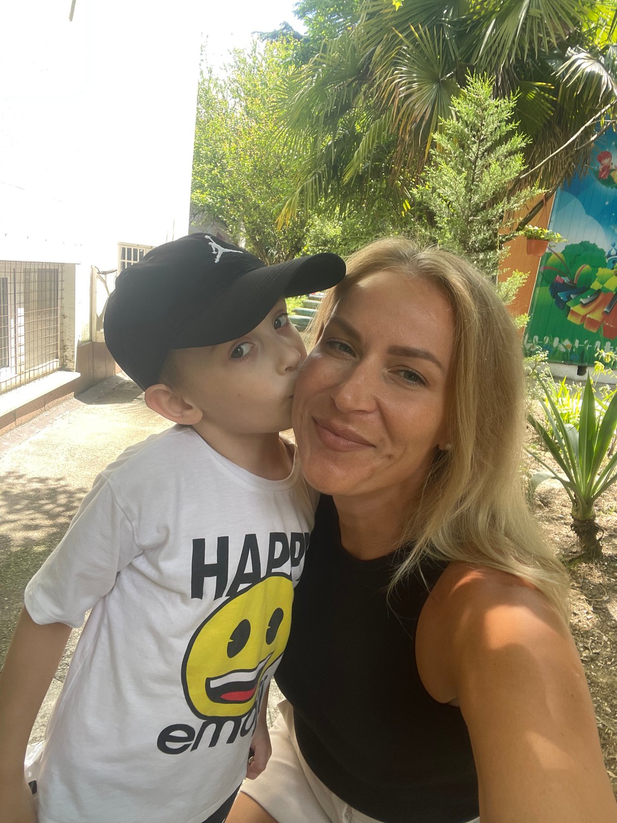 Mother and son share casual moment in Sochi