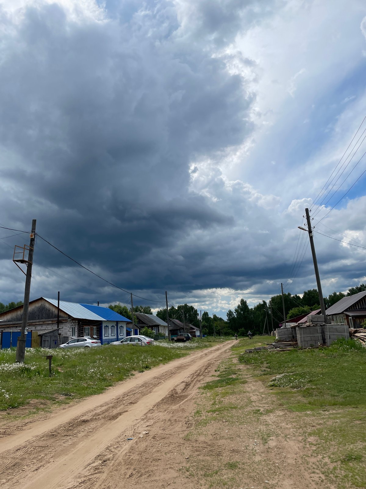 Storm clouds gather over rural Russian village Балдейка