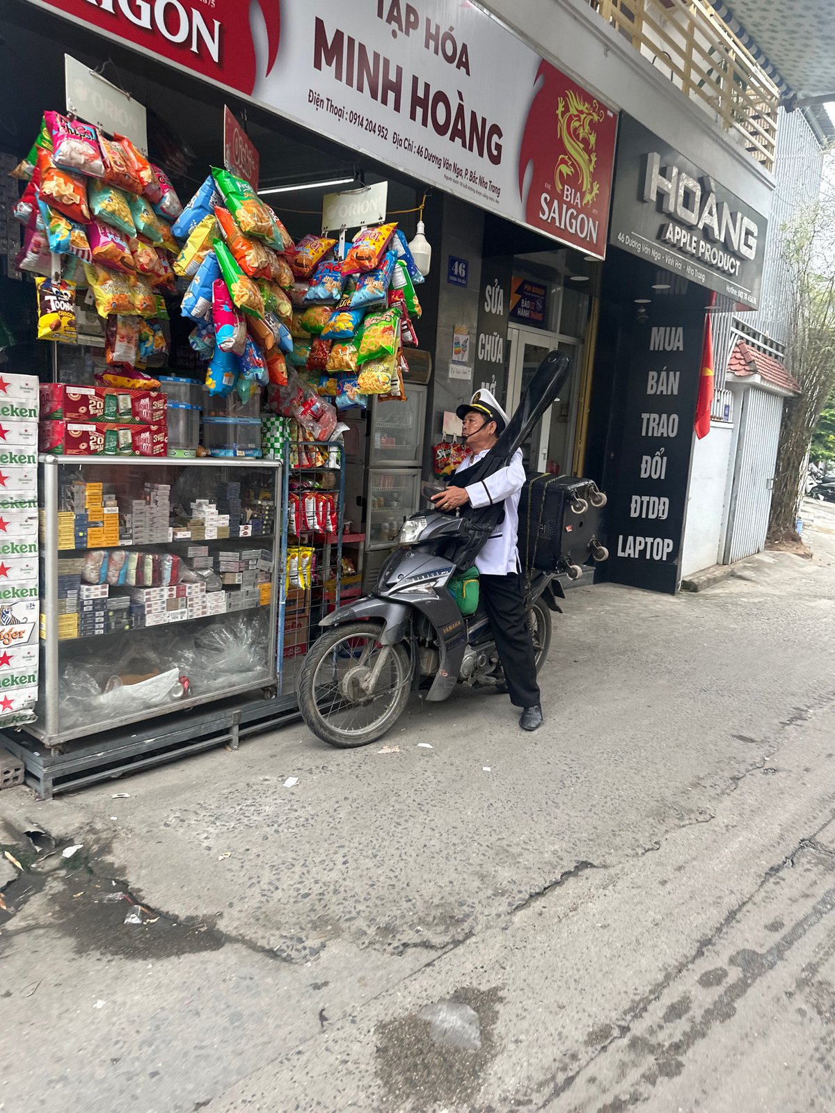 Girl plays with poodle in Vietnam neighborhood scenes