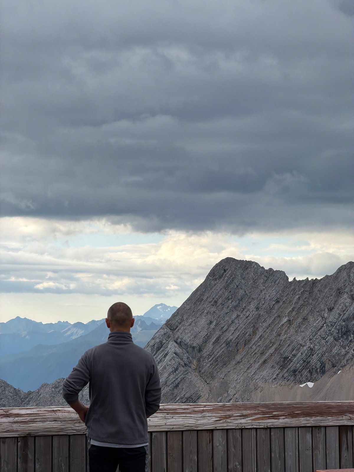 Rocky Bavarian peaks from a wooden mountain viewpoint