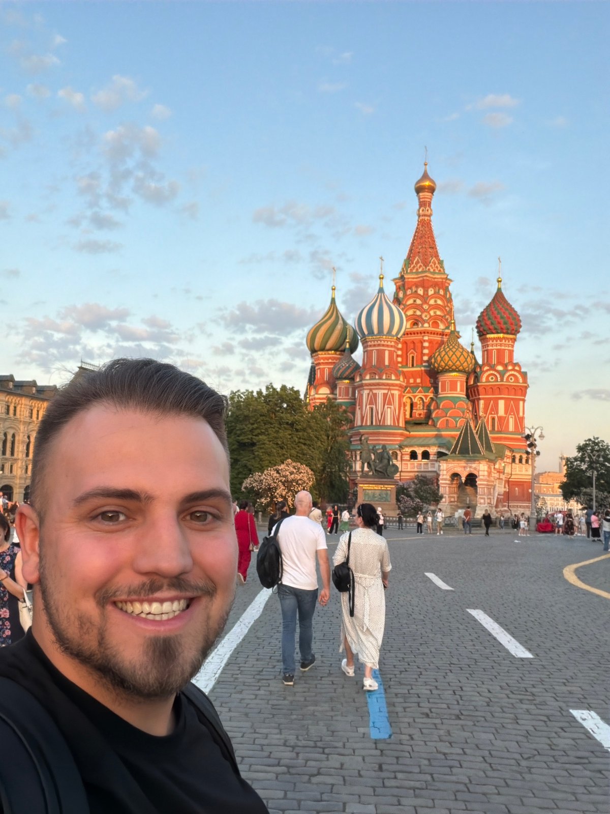 Tourist documents evening stroll through Moscow's Red Square landmarks