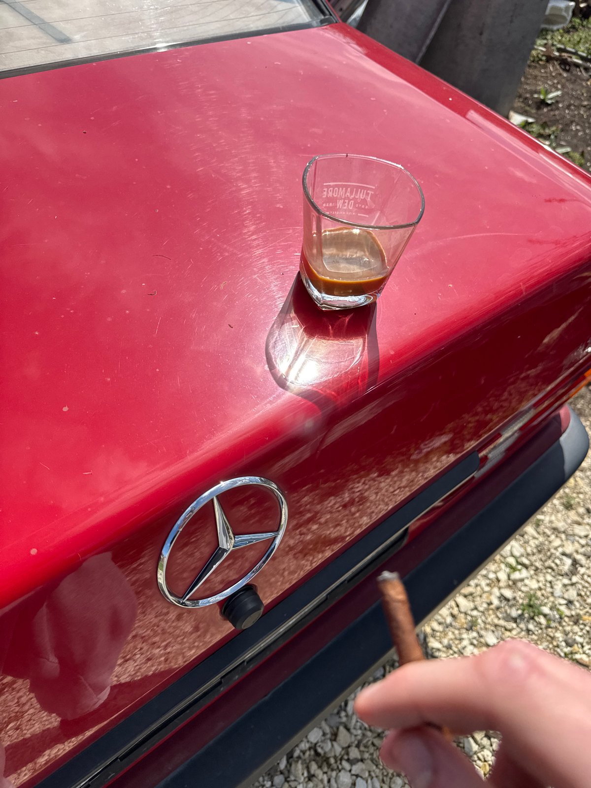 Coffee break by red Mercedes in Bulgarian village