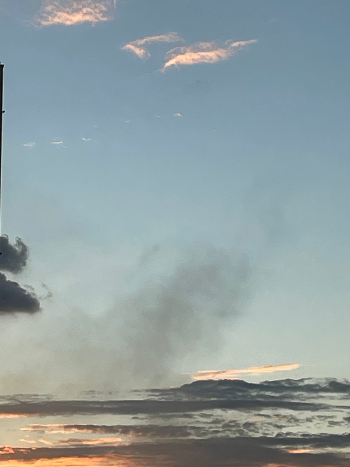 Omsk skies tracked through clouds, color shifts, and a smoke plume