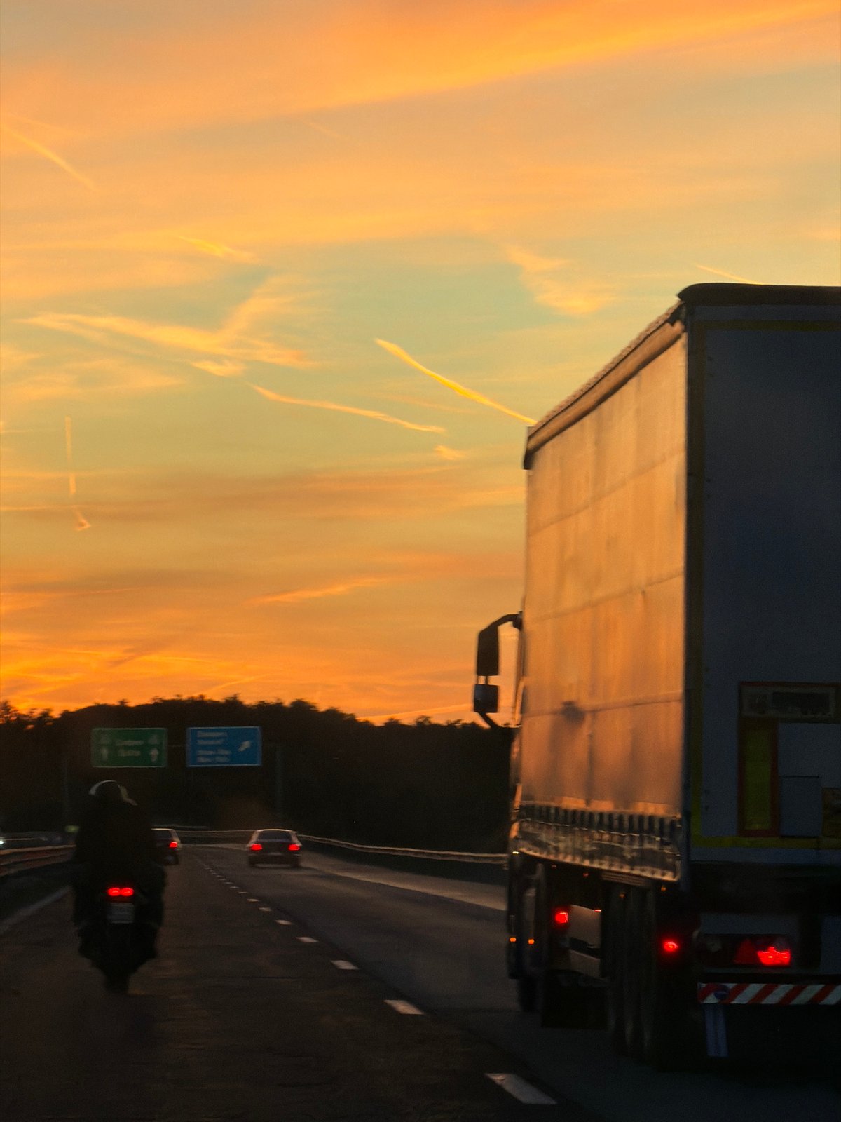 Highway traffic observed during sunset near Baliovtsi, Bulgaria