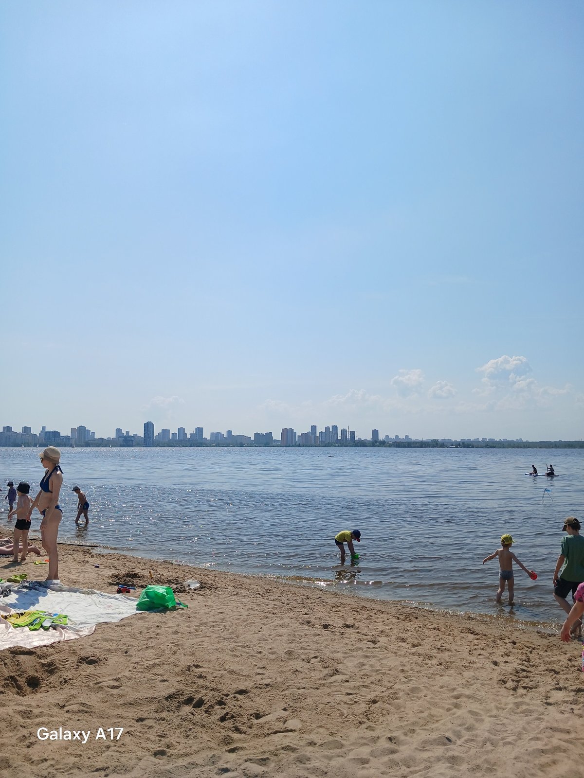 Early morning beachgoers gather at Yekaterinburg waterfront
