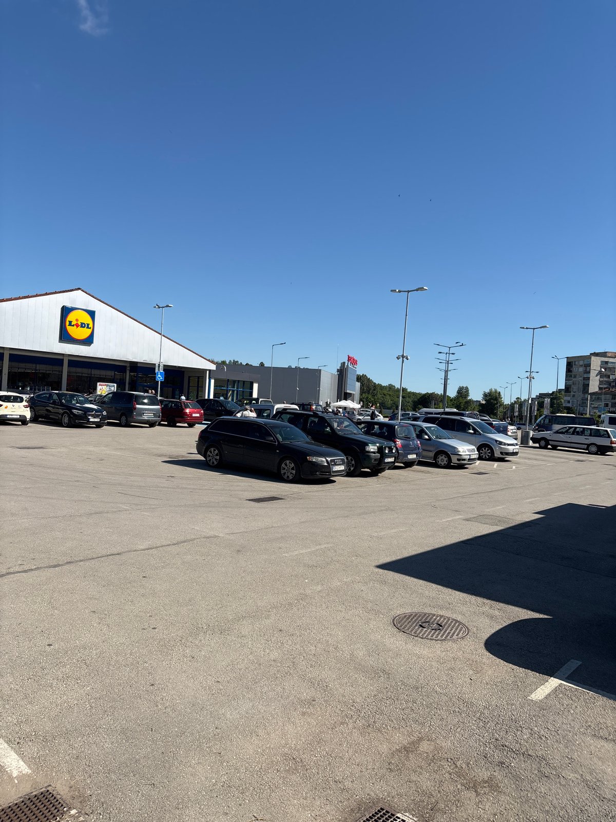Busy Lidl store parking lot observed in Lovech, Bulgaria