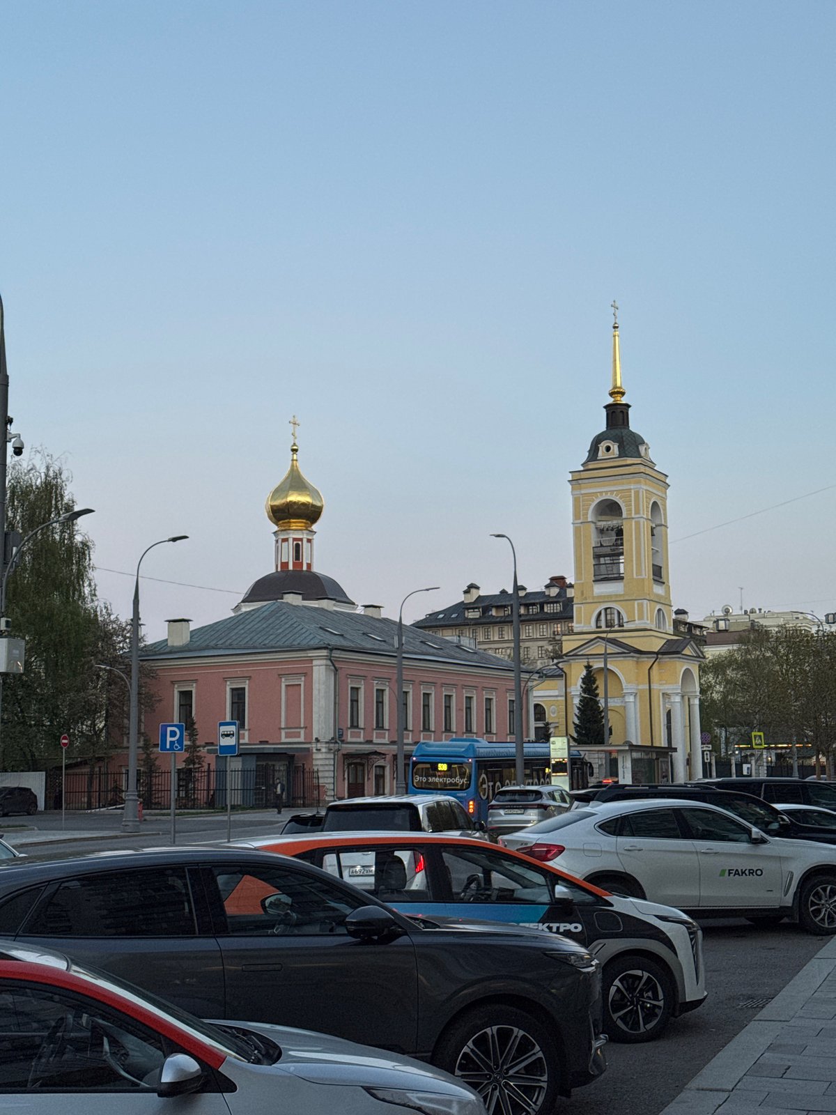 Moscow street scenes documented showing churches, buildings under clear skies