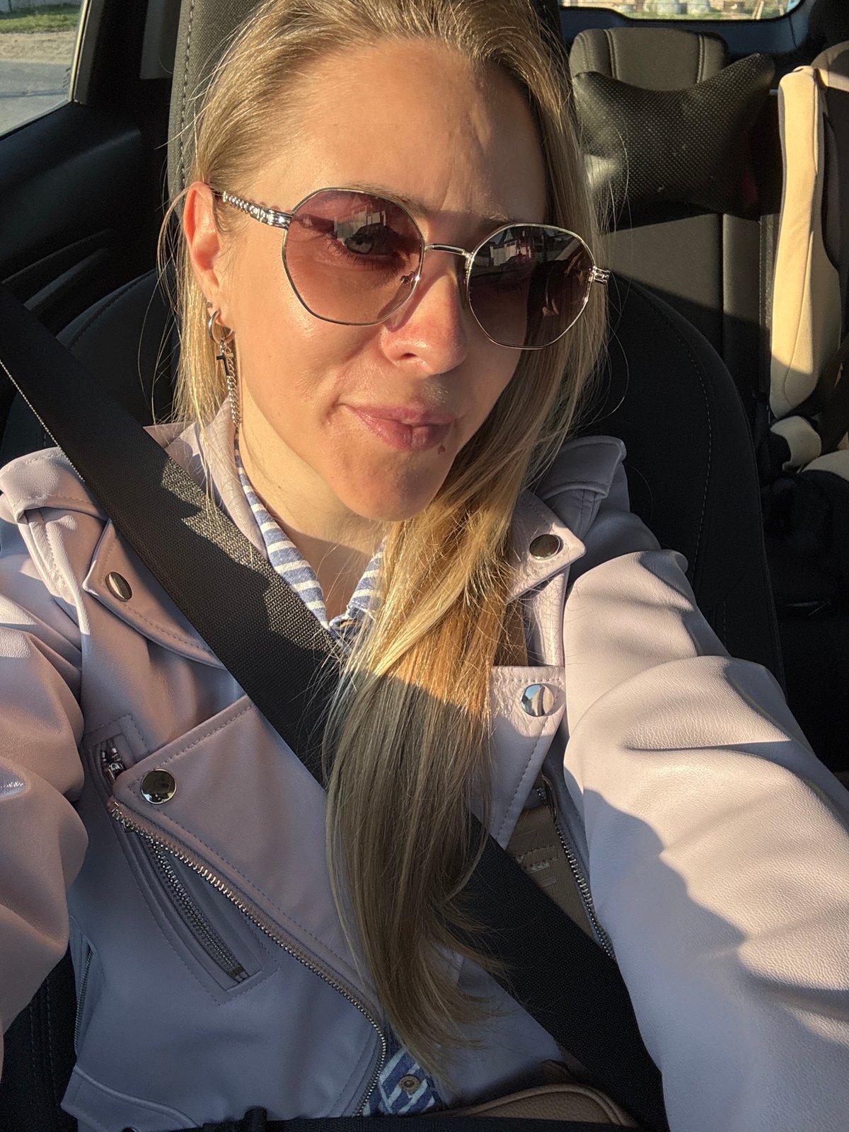 Woman documented in car and home settings in Chaikovsky