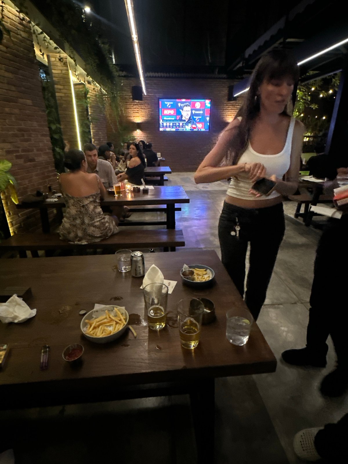 Dancing and pool at a festive outdoor bar night in Kuta Selatan
