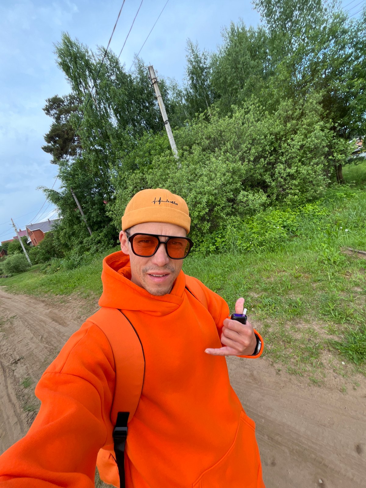 Man in orange photographed multiple times in Chaikovsky, Russia