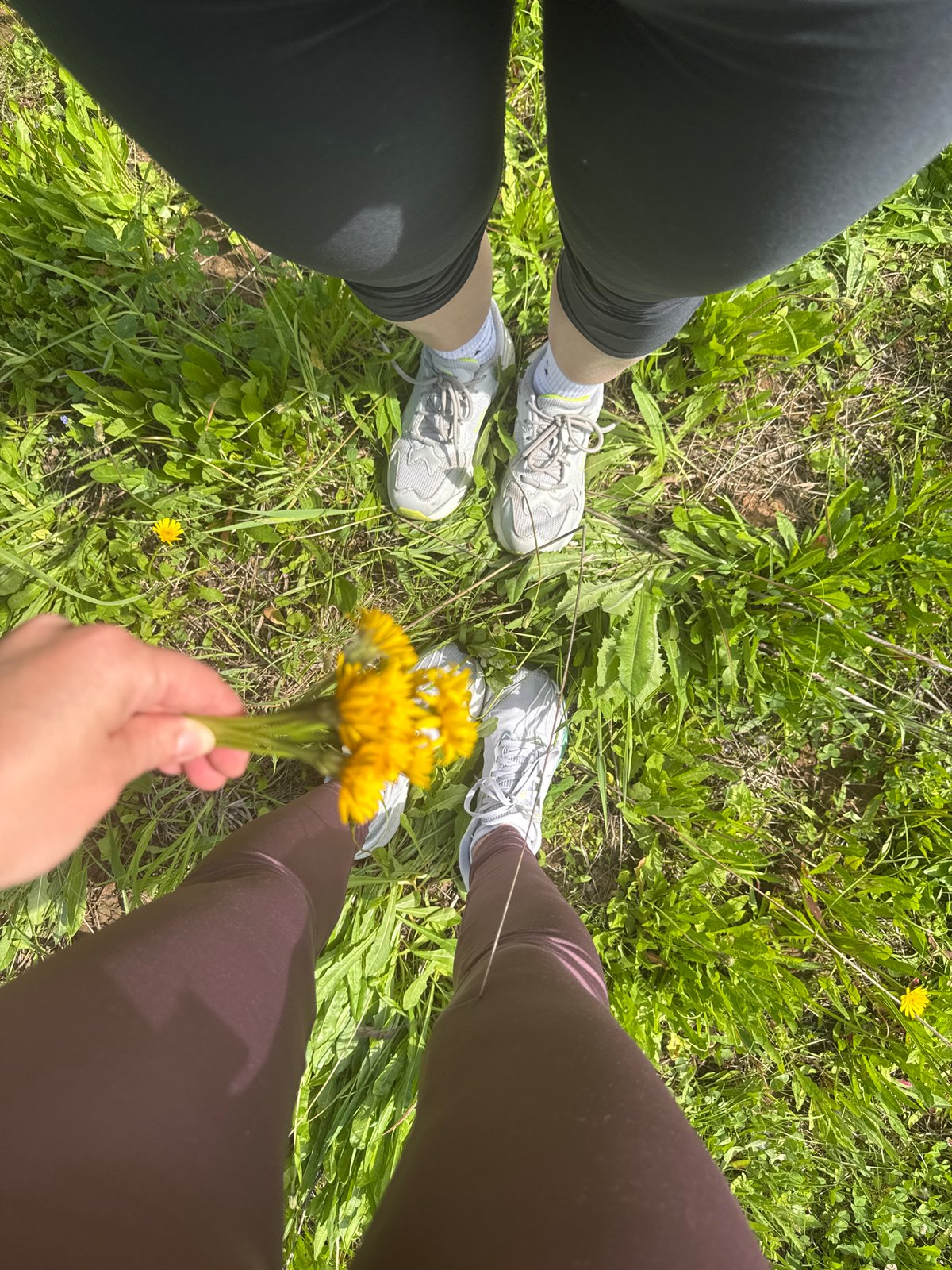 Two people enjoy sunny afternoon in Chaikovsky field