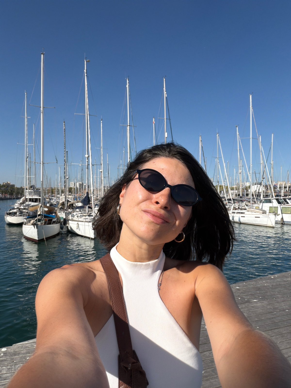 Sunny afternoon brings visitors to Barcelona's marina waterfront