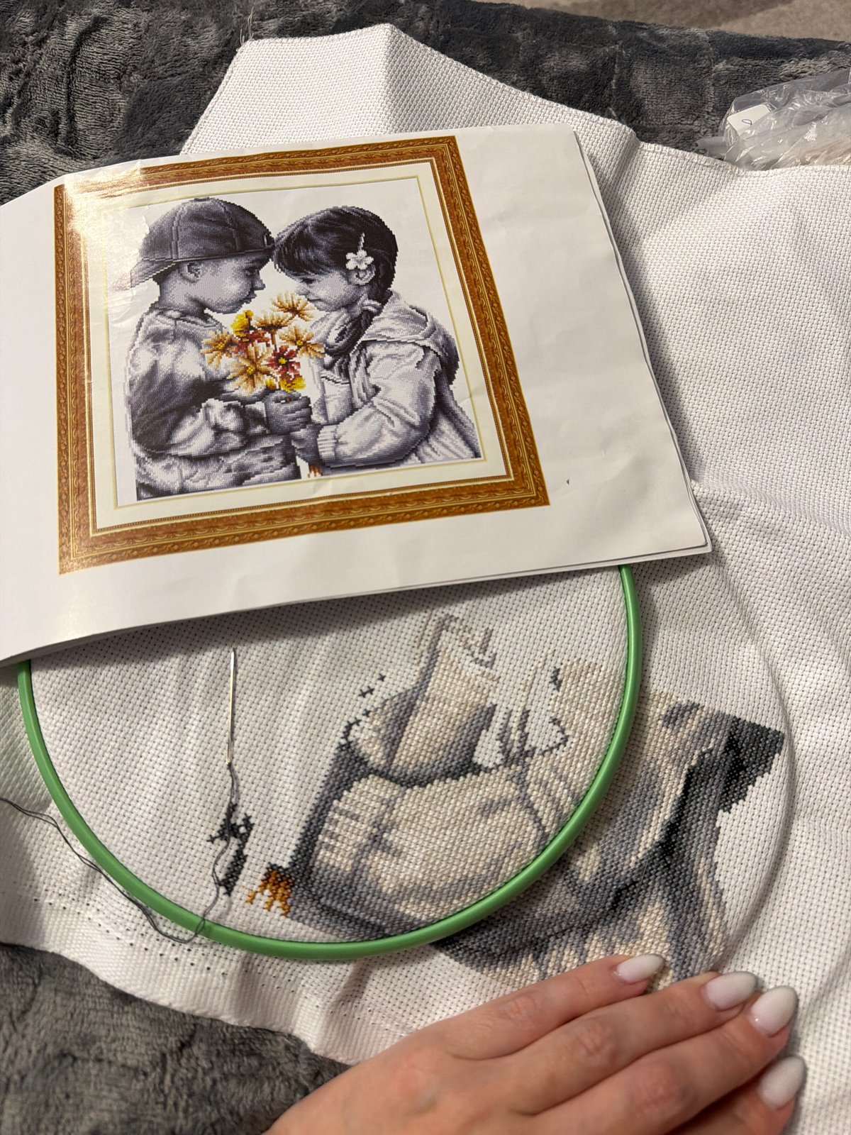Craft enthusiast works on cross-stitch project in Chaikovsky home