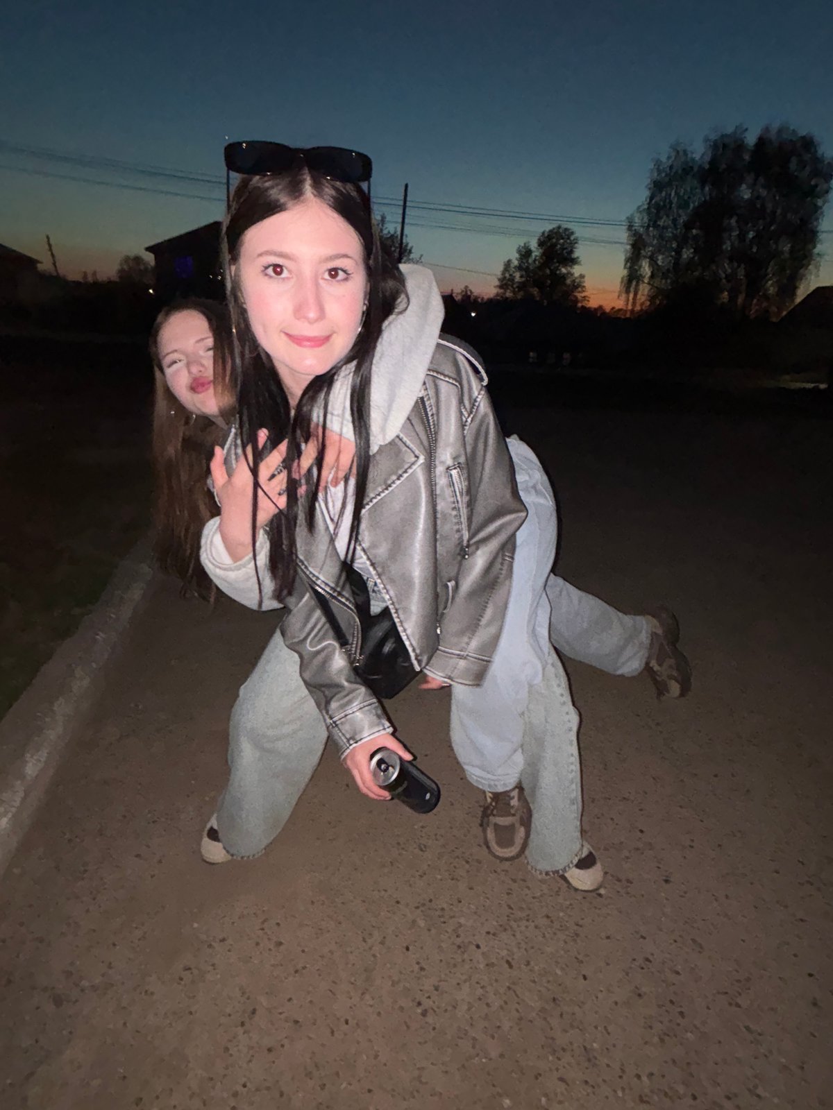 Two women document twilight photo session in Фоки, Russia