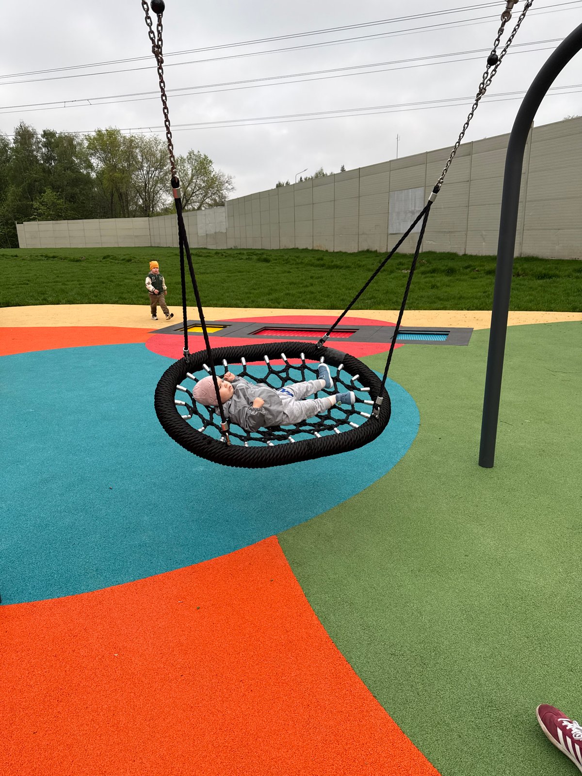 Families use Moscow playground and fitness area Tuesday afternoon