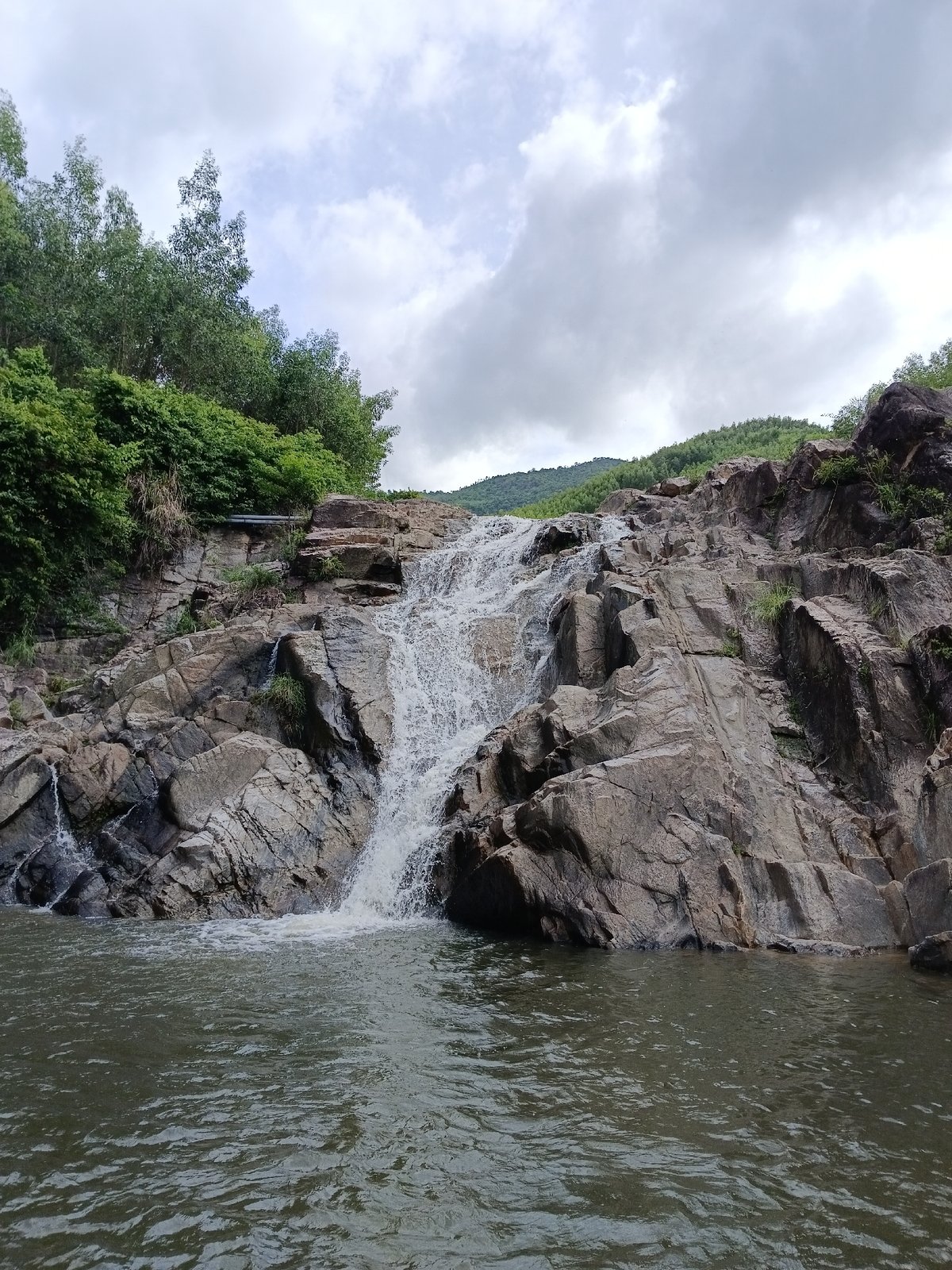 Rocky waterfall and jungle hills near Đà Nẵng
