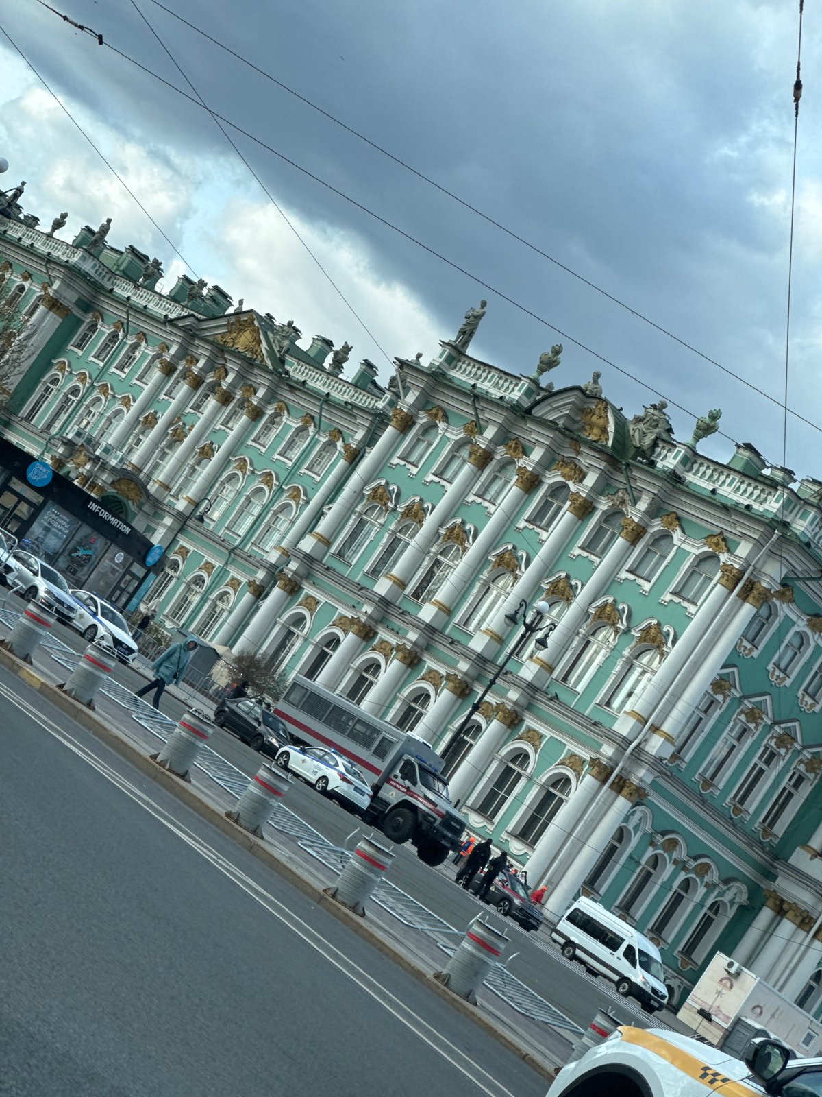 Tourist documents Winter Palace and Admiralty landmarks in Saint Petersburg
