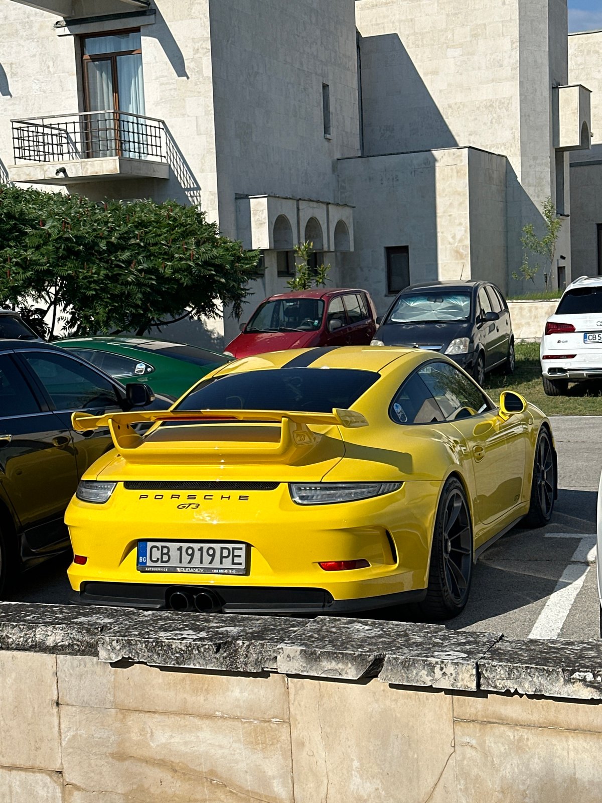 Yellow and green Porsches parked up in Arbanassi, Bulgaria