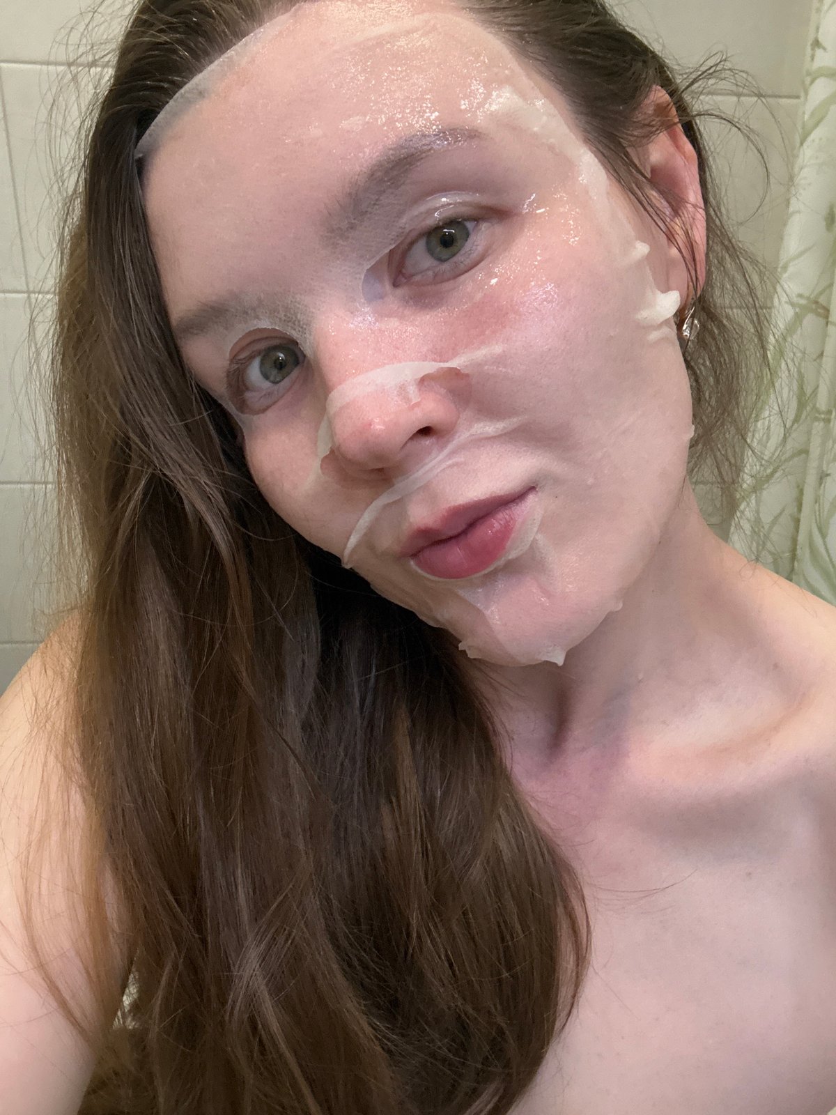 Woman documents skincare routine with facial mask in Izhevsk