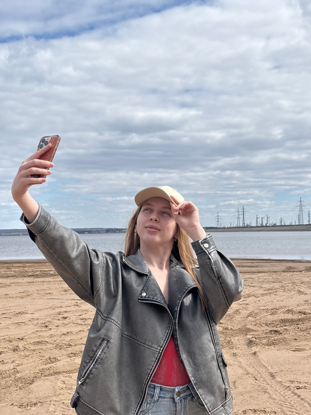 Young people gather for beach photos and socializing in Noviy