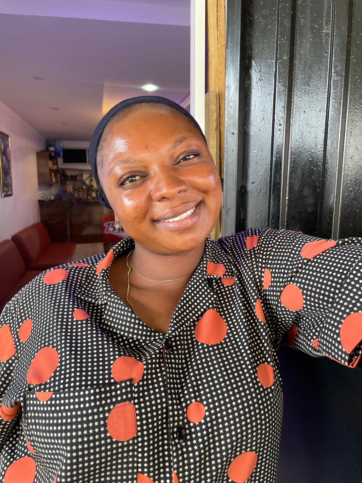 Woman celebrates with blue balloon across Jos, Nigeria