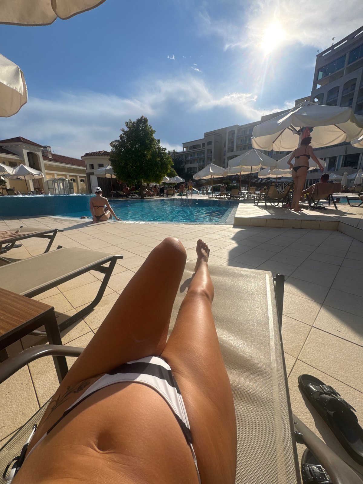 Lazy afternoon at a Boreti resort pool, sun and swimming