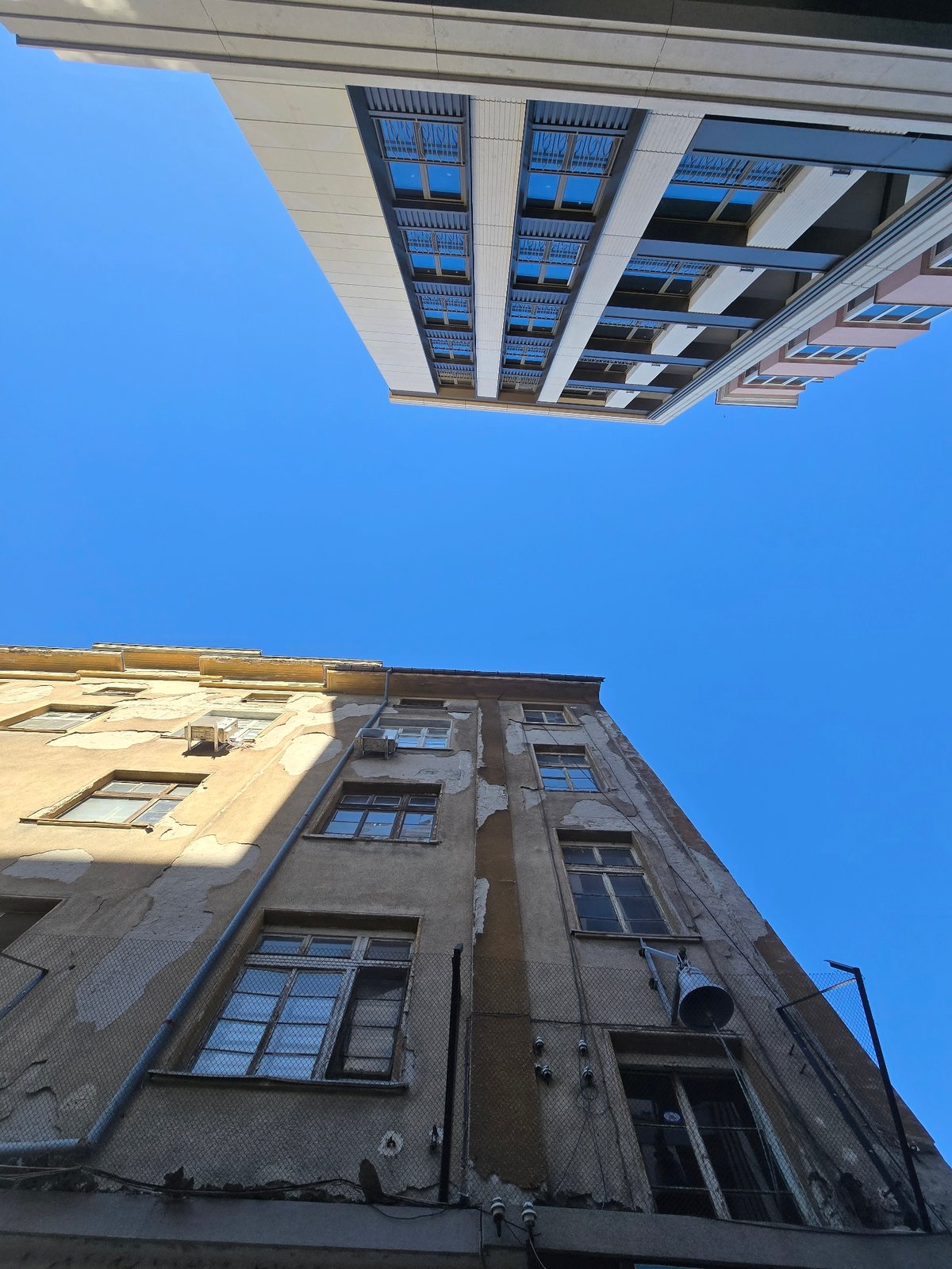 Urban documentation captures buildings, eagle statue, and #Build signage