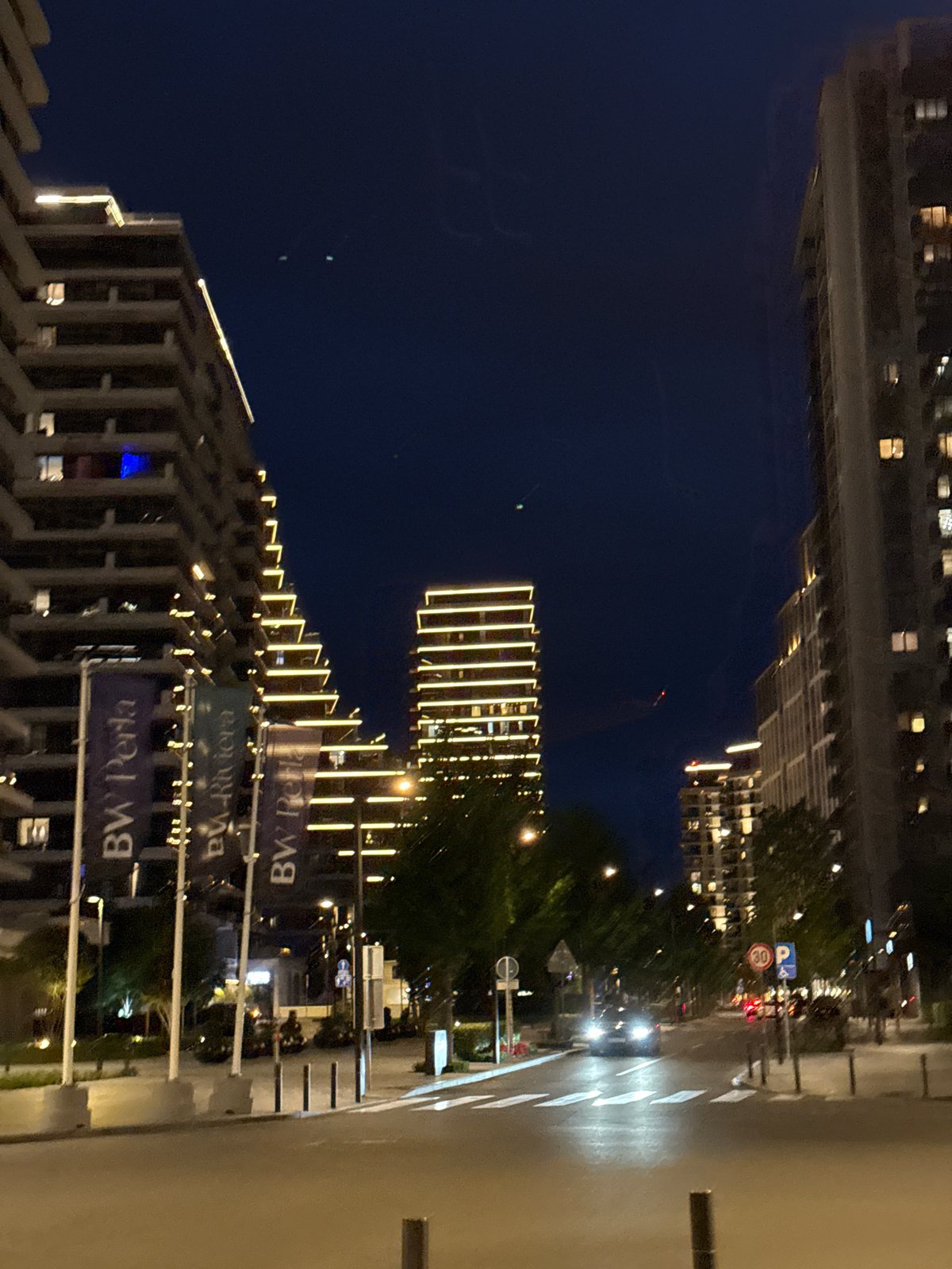 Evening urban life documented across modern Belgrade district