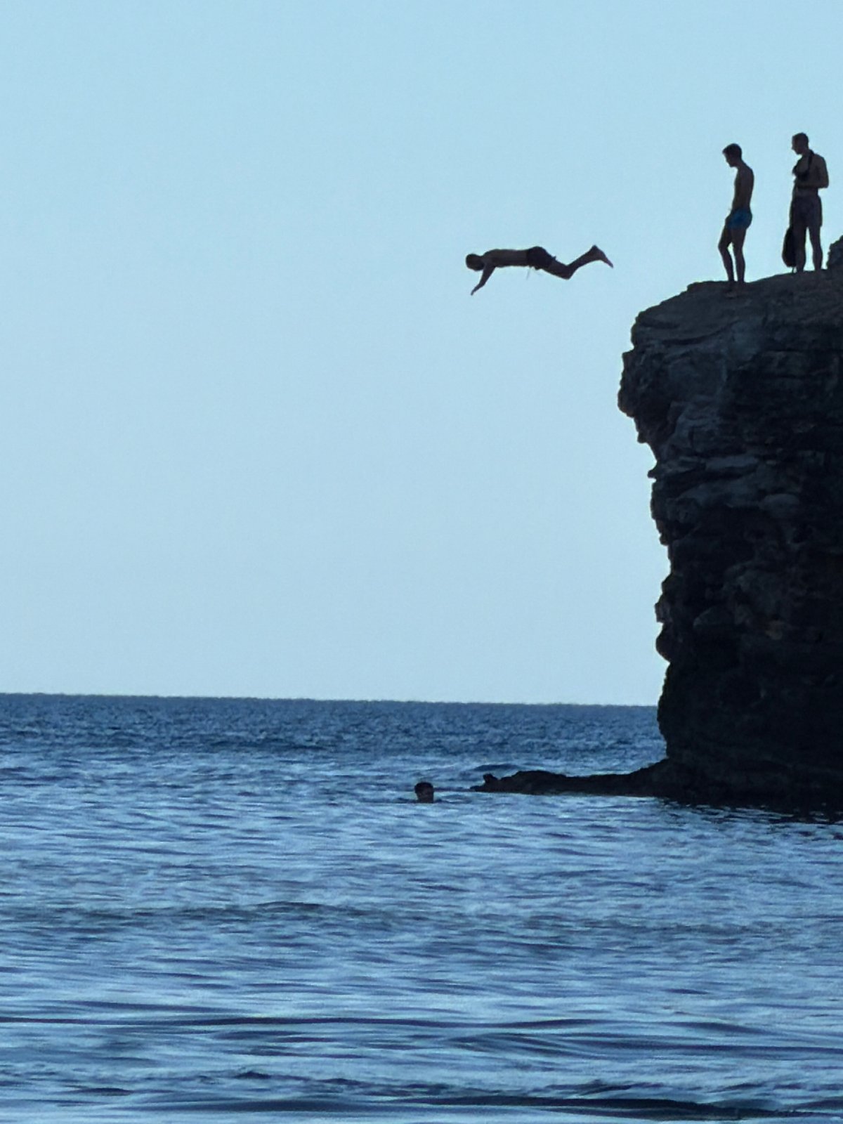 Cliff diving and swimming at a rocky Budva coastal spot