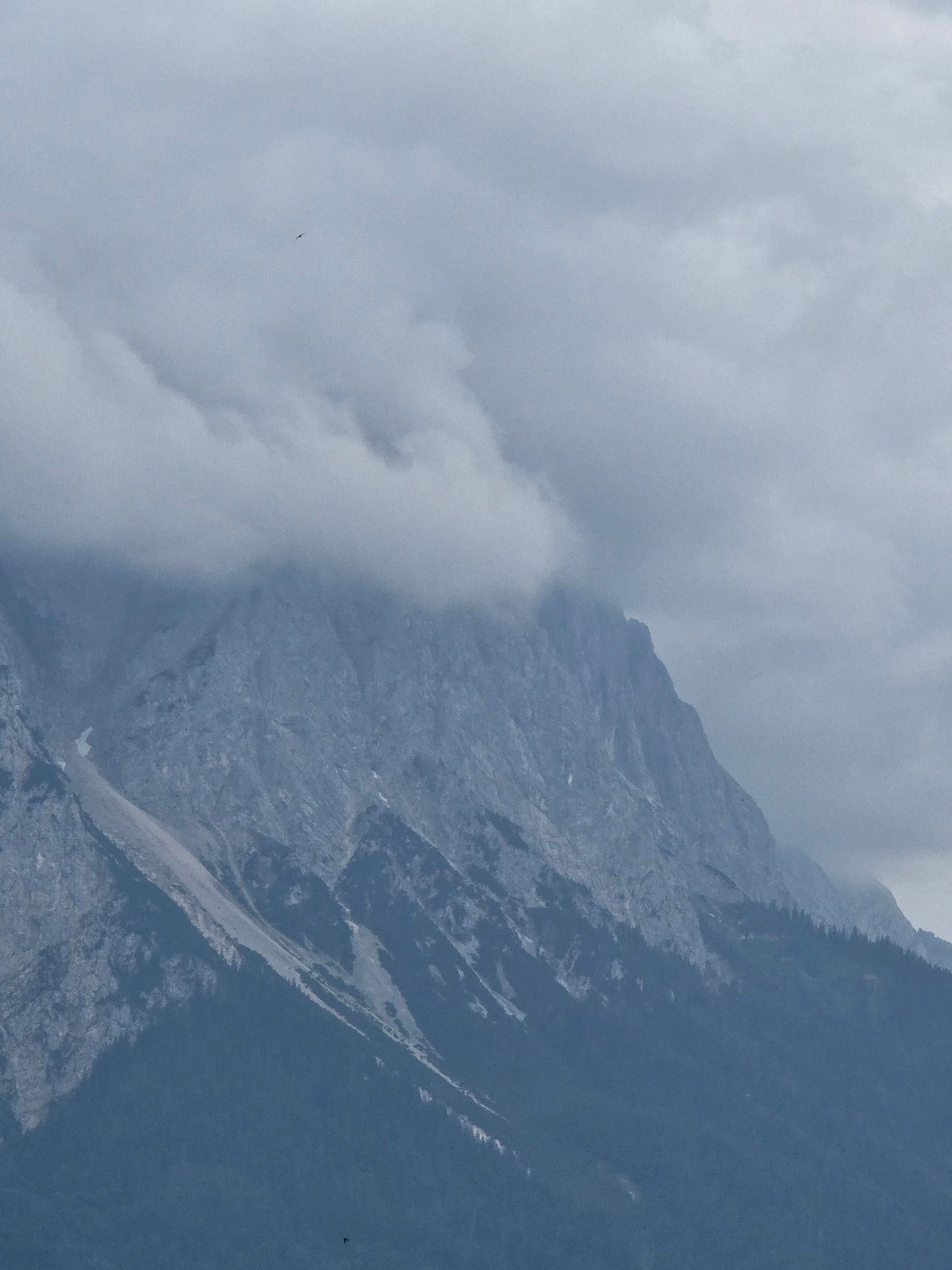 Alpine peaks and town edges, Garmisch-Partenkirchen under overcast skies