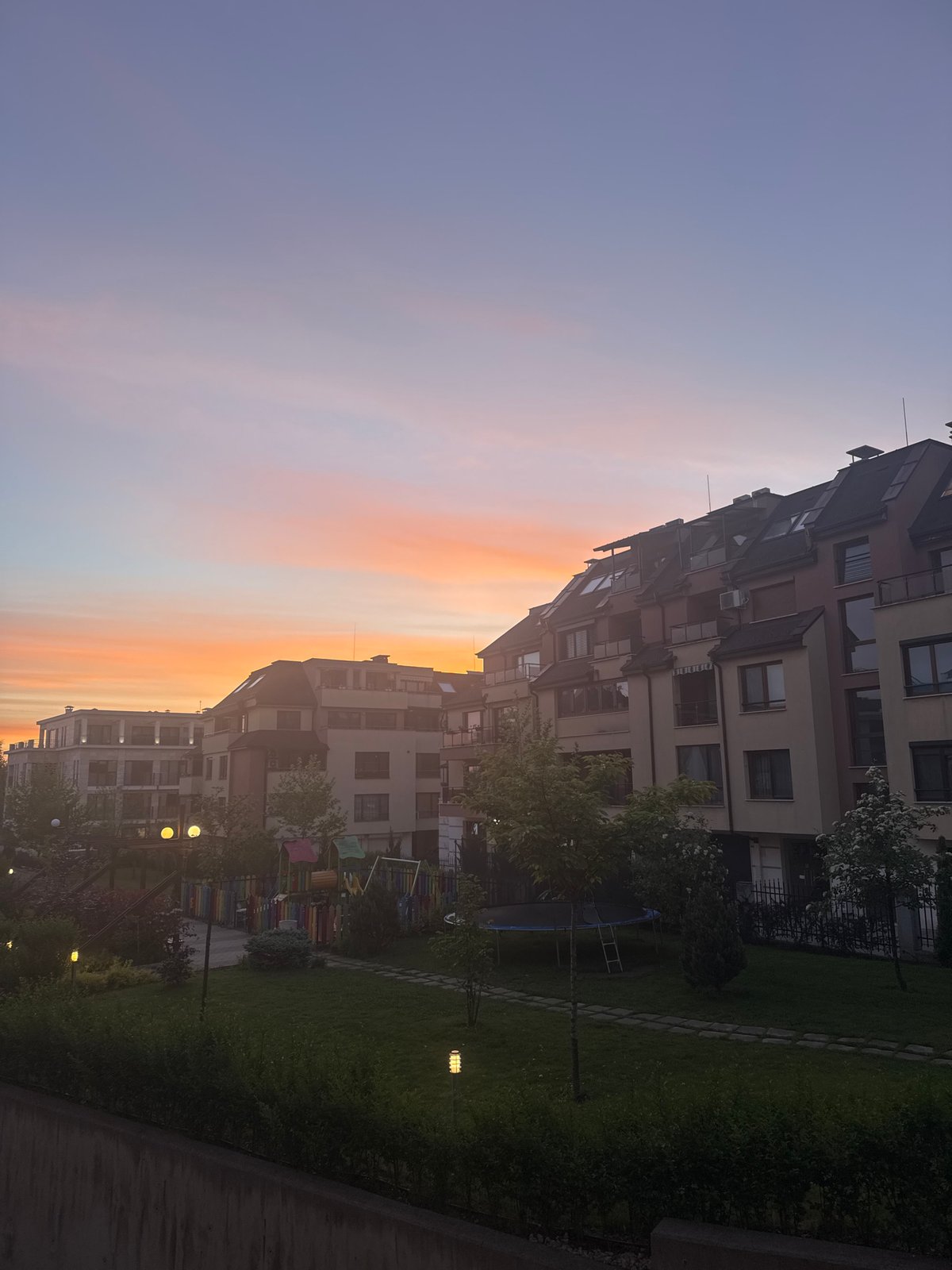 Sunset illuminates modern apartment complex in Sofia, Bulgaria