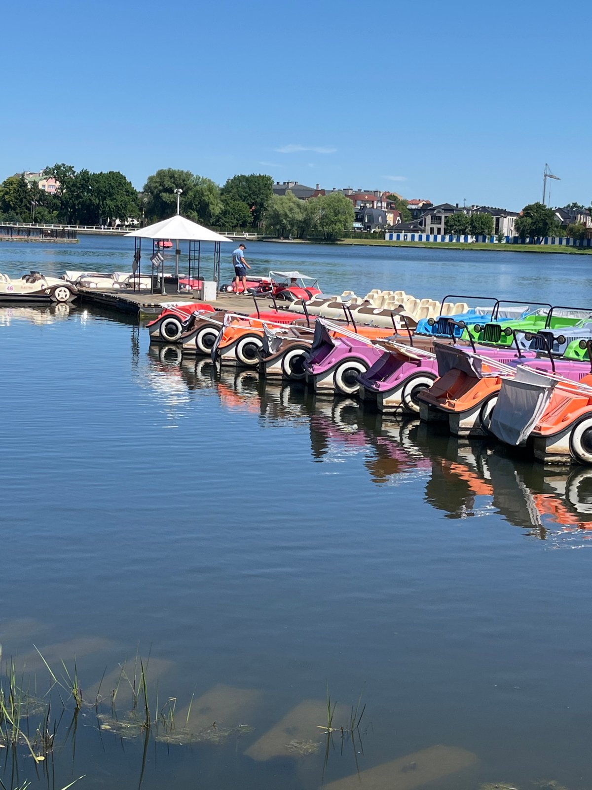 Kaliningrad waterfront: canals, parks, and pedal boats on a sunny morning