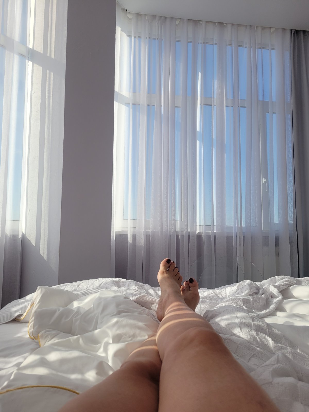 Person rests in bedroom during early morning hours