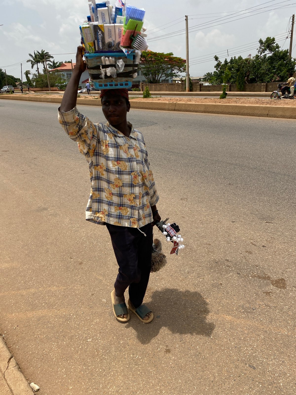 Daily life unfolds in Bukuru, Nigeria streets and fields