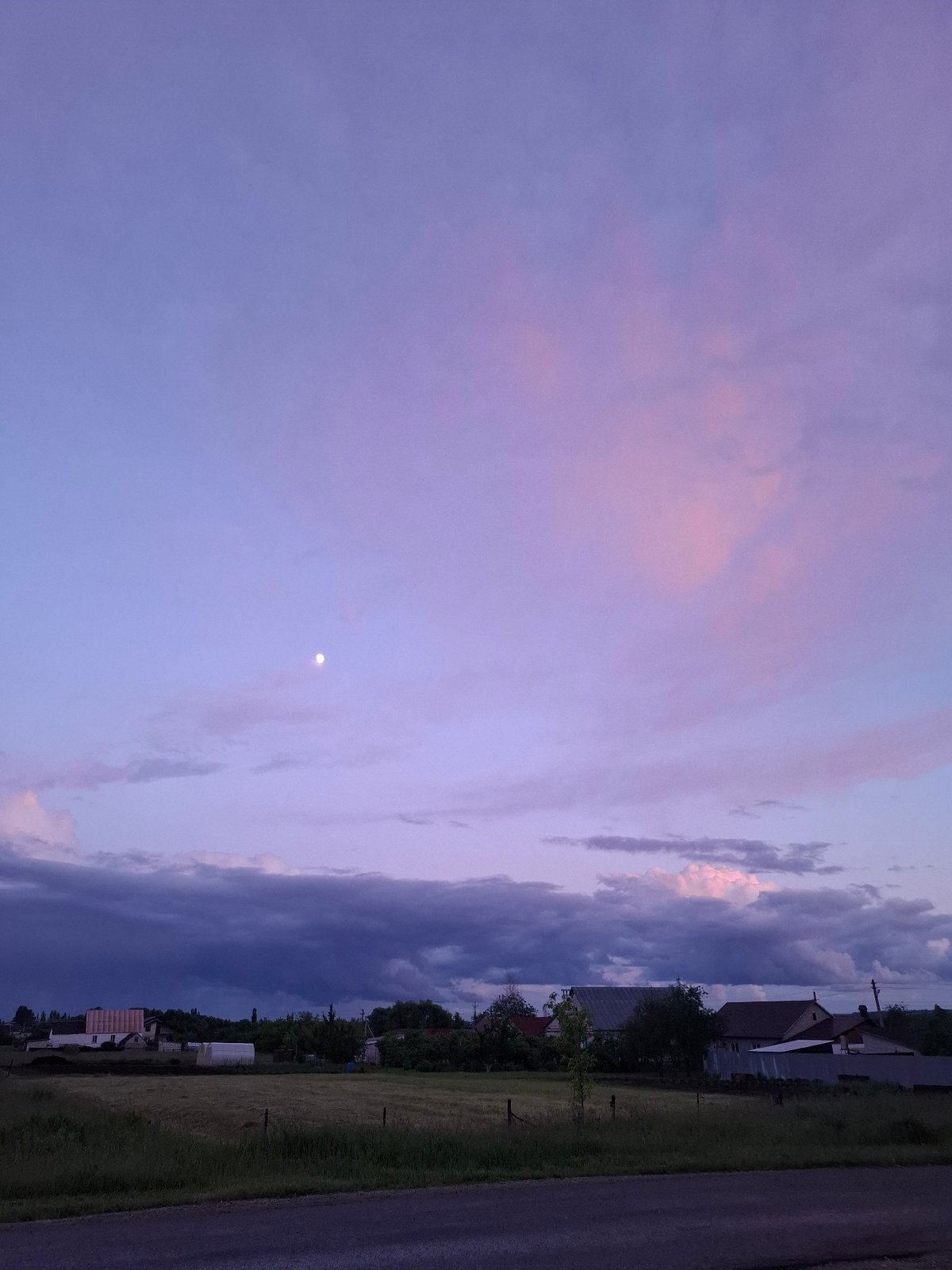 Dramatic sunset skies observed over rural Khlevnoye, Russia