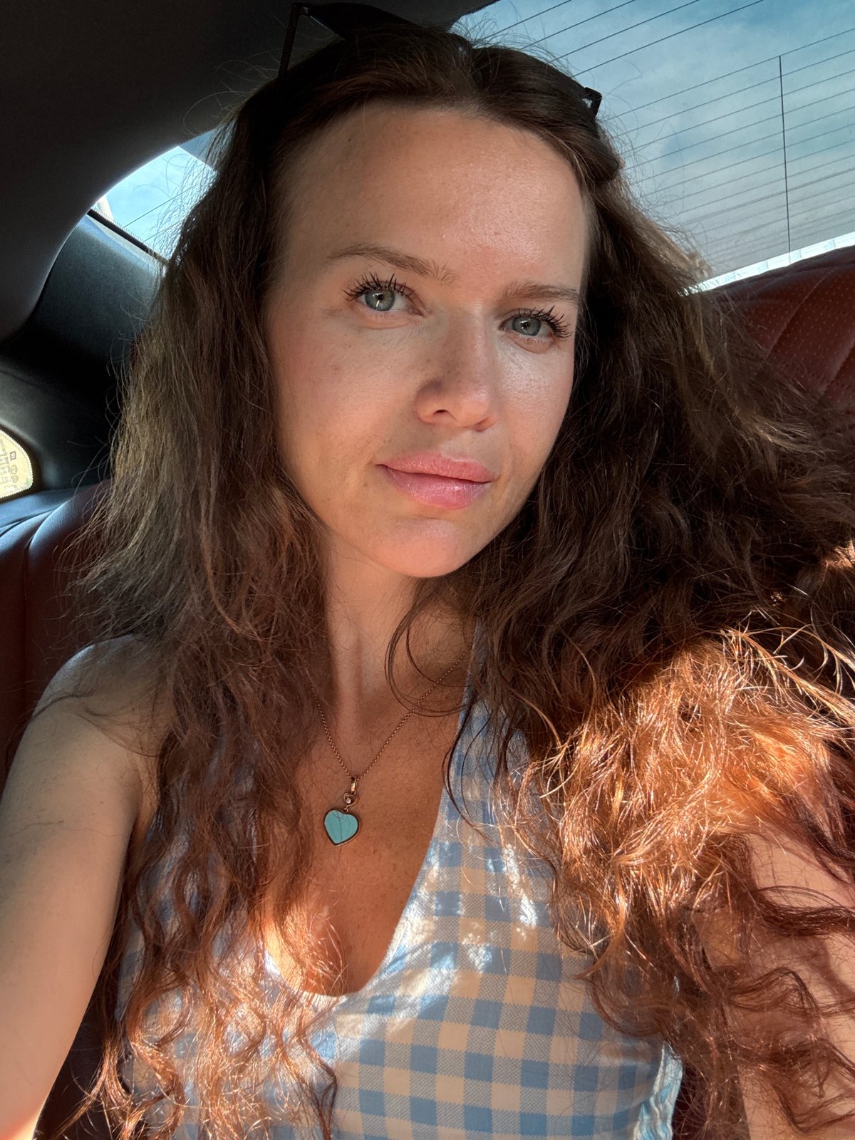 Casual car selfie taken in Moscow on a July afternoon.