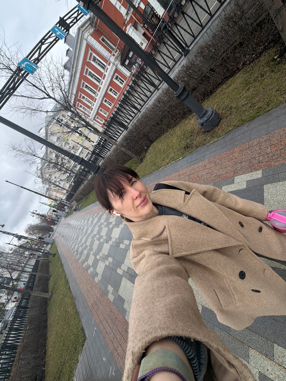 Morning street scenes captured on brick sidewalks in Perm