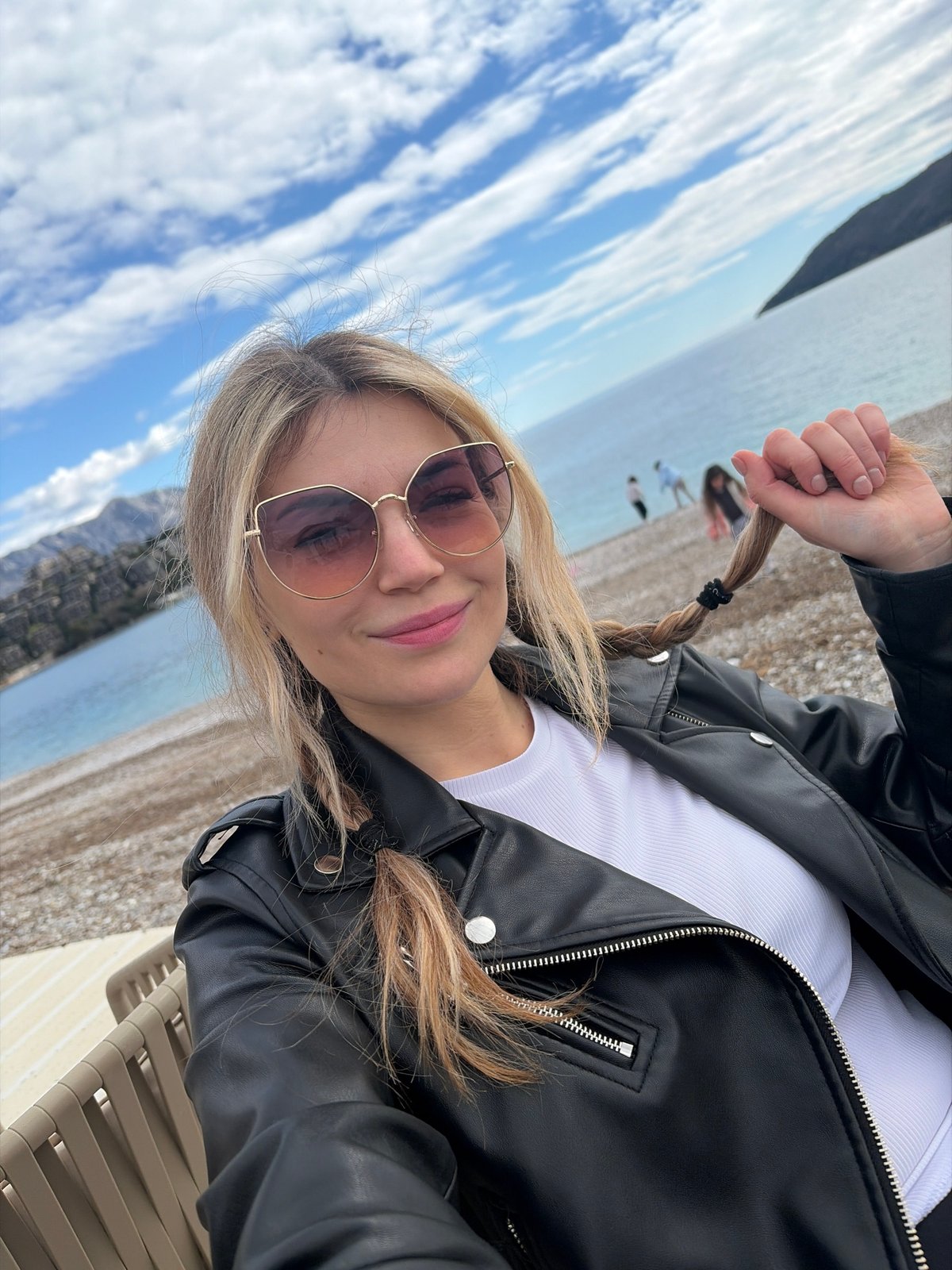 Couple enjoys beachside cafe visit in Budva, Montenegro