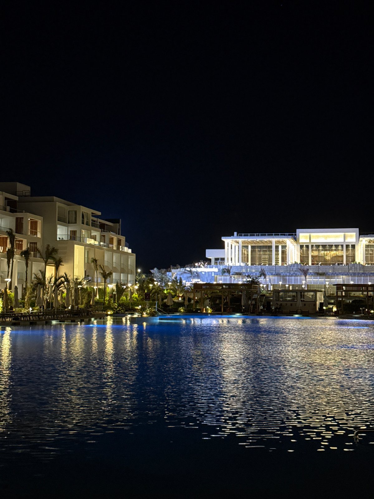Sharm El Sheikh resort at night, pools and buildings lit up