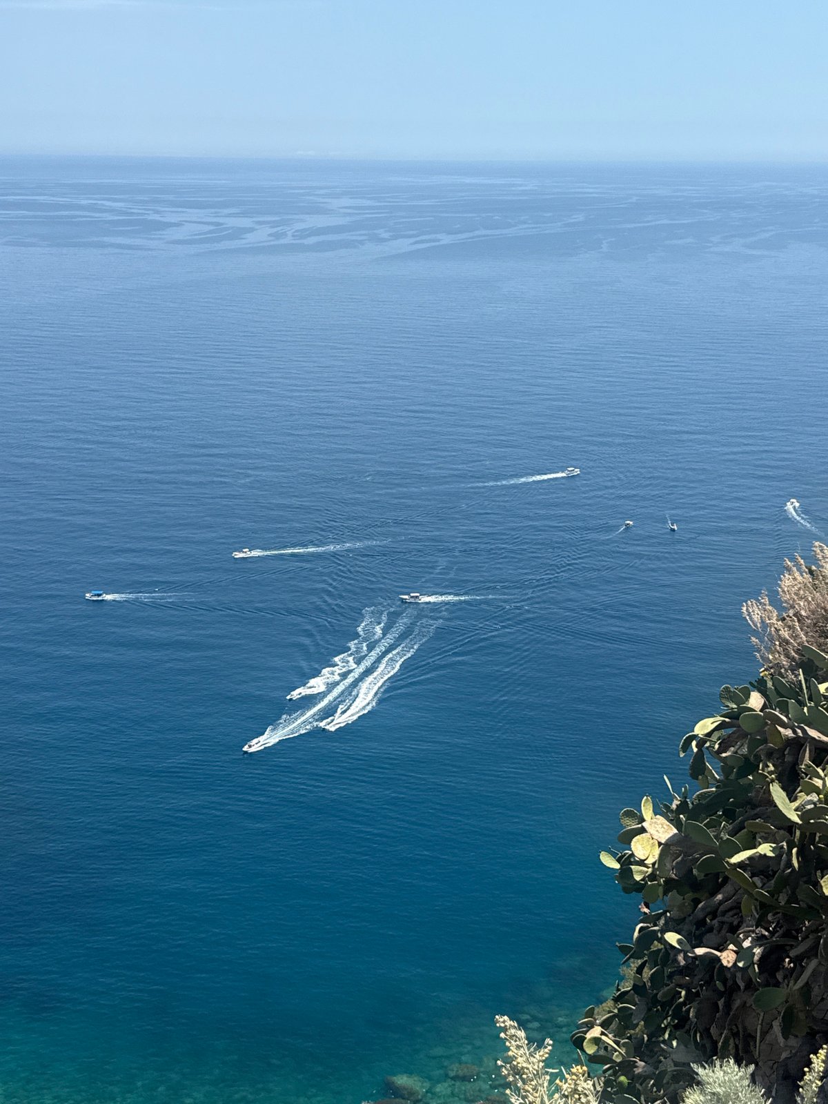 Scenic coastal views captured from elevated positions in Taormina
