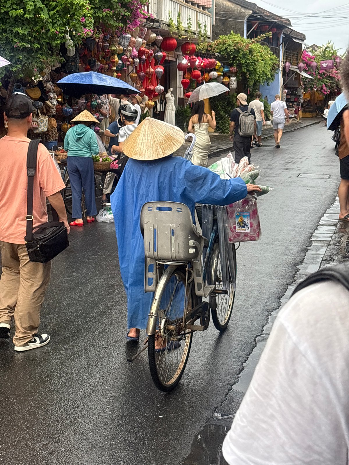 Rainy day street life in Hoi An's Old Town